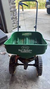 lot 59115 image: Scotts Turf Builder EdgeGuard Mini Broadcast Spreader - Retail $45