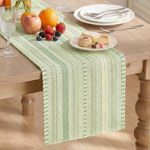 lot 7937 image: Artoid Mode Sage Green Farmhouse Woven Table Runner, Seasonal Holiday Rustic Kitchen Dining Table Decoration for Home Party Decor 12x72 Inch - Retail $14