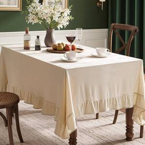 lot 8069 image: MIULEE Beige Velvet Table Cloth with Decorative Ruffle Edge Luxurious Soft Spring Washable Rectangular Tablecloth Thick Wrinkle-Resistant Oblong Table Cover for Kitchen Dining Wedding 60x120 Inch - Retail $32