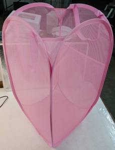 lot 26940 image: Pink Mesh Pop-Up Laundry Hamper - Collapsible mesh laundry basket with pink fabric construction and multiple compartments for sorting clothes and household items - Retail $8