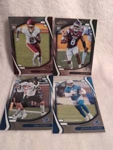 lot 1034 image: 2021 Panini Absolute Football Rookie Cards Lot - 4 ct