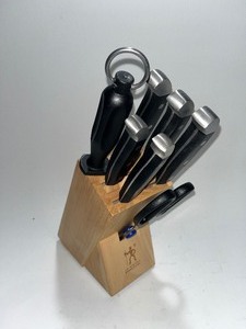lot 7 image: 8 Piece J.A. Henckels International Knife Block Set - Professional Quality - Slicing , Santoku , Bread, 2 Steak, Sharpener, & Scissors - Thick Handles