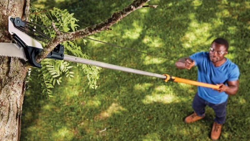 lot 150 image: Fiskars Power-Lever 14 ft. Steel Curved Extendable Tree Pruner Retails $70