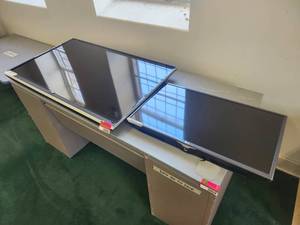 lot 20040 image: 32 inch LG LCD Television with 55 inch TCL TV Bundle