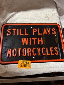 lot 27768 image: Still Plays With Motorcycles Metal Sign