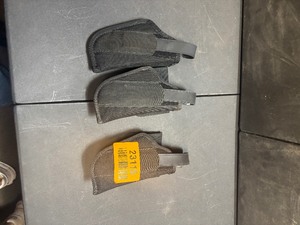 lot 23115 image: 3 Uncle Mikes Sidekick Pistol Holders Size 15