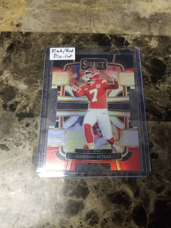 lot 1264 image: 2023 Panini Select BlackRed Die-Cut Football Harrison Butker Kansas City Chiefs Card