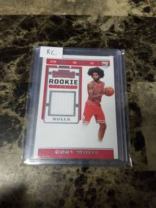 lot 442 image: 2019 Panini Contenders Basketball Player Worn Jersey Coby White Rookie Card