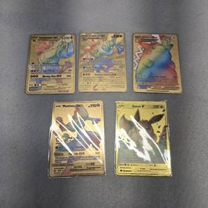 lot 407 image: Pokemon Gold Plated Card Collection - Incineroar, Greninja, Pikachu VMax, Mewtwo, Eevee Metal Fan Art