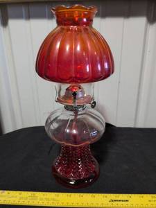 lot 32 image: Ruby Red Glass Oil Lamp with Daisy & Button Pattern