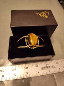 lot 152 image: Tigers Eye Gold Tone Hinged Bangle