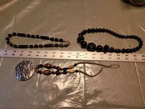 lot 202 image: Black and Gold Beaded Necklace Set with Zebra Print Pendant