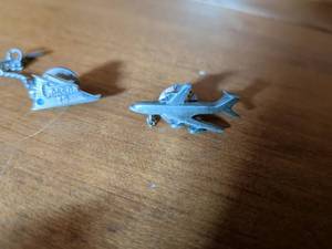 lot 234 image: Cessna Aircraft Silver Tone Charm and Pin Set