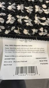 lot 3014 image: Black and Ivory Braided Accent Rug 30x46 inches