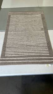 lot 3070 image: Brown and White Striped Area Rug, 30x47