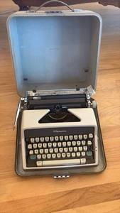 lot 17 image: Vintage 1960s Olympia Manual Portable Typewriter with Case RETAIL $150