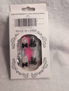 lot 2661 image: Press-On Artificial Nails with Black Bow Decorations