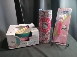 lot 3479 image: Hello Kitty Kitchen Dinnerware Set with Chopstick Bowl Tumbler and PEZ Dispenser