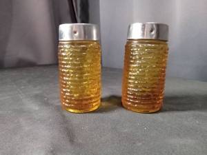 lot 4440 image: Amber Glass Salt and Pepper Shakers with Chrome Tops