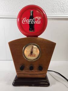 lot 74 image: Coca Cola Themed  AMFM Radio with Wood Case and Red Display