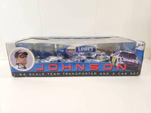 lot 129 image: Jimmie Johnson #48 Lowes NASCAR 164 Scale Team Transporter and 3 Car Set