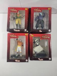 lot 165 image: Street Fighter Action Figure Collection - Rolento, Oni, El Fuerte, Rashid