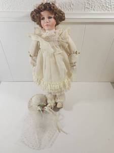 lot 182 image: Porcelain Doll in Victorian White Dress with Curly Hair and Lace Bonnet