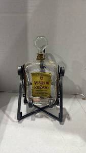 lot 2014 image: Amaretto di Saronno Glass Bottle with Metal Stand