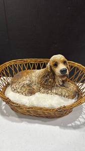 lot 2073 image: Dog figurine in wicker dog bed