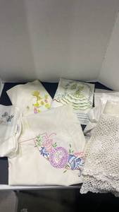 lot 2081 image: Vintage embroidered linens some with stains see photos