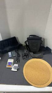lot 2106 image: Battery charger, camera bag, cork mats, pedometer and more