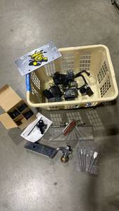 lot 2111 image: Ball hitch, cargo tie down, drill bits, various tool chargers and more