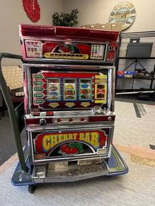 lot 2500 image: Dendo Electrocoin game machine 32 x 19 x 16 in (does not work, keys do not fit, top locking mechanism has been drilled out, does not power up when plugged in)