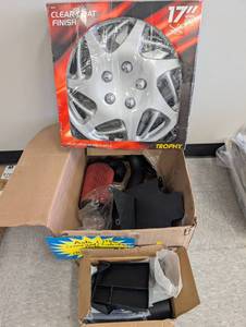 lot 8 image: 17 Inch Wheel Covers, compartment liners & misc parts  - Retail $234