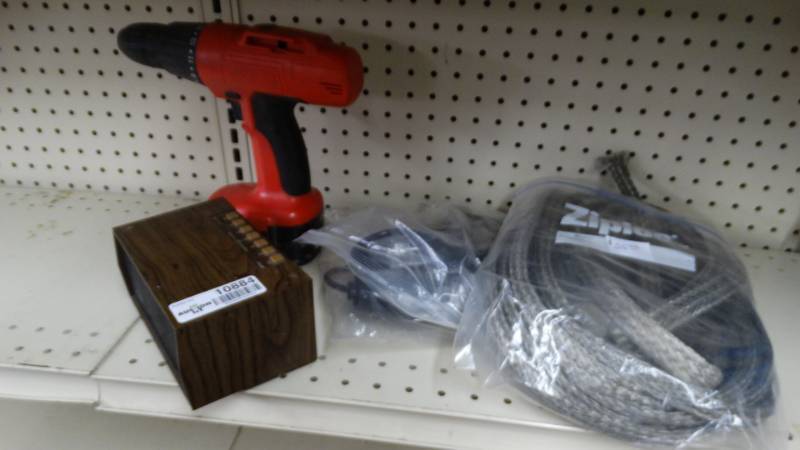 lot 10884 image: Electric drill, alarm clock, and steel wire