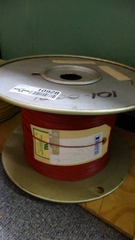 lot 10928 image: Red pvc wire on spool.