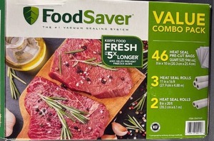 lot 40 image: FoodSaver Vacuum Sealer Bags and Heat Seal Rolls Open Box, Appears Complete