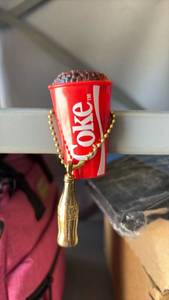 lot 253 image: Vintage Coca-Cola Magnet with Gold Tone Coca Cola Keychain