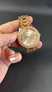 lot 321 image: Bebe womens watch in rose gold tone featuring a crystal bezel and a bracelet design.