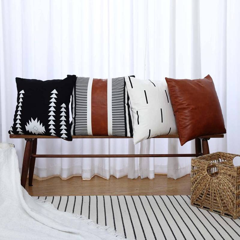 lot 16371 image: Boho Throw Pillow Covers 20 x 20 Set of 4 - Modern Stripe Geometric Farmhouse Decorative Pillow Cover Sets for Pillows - Couch Sofa Bed, Faux Leather Black and White Pillow Covers - Retail $20