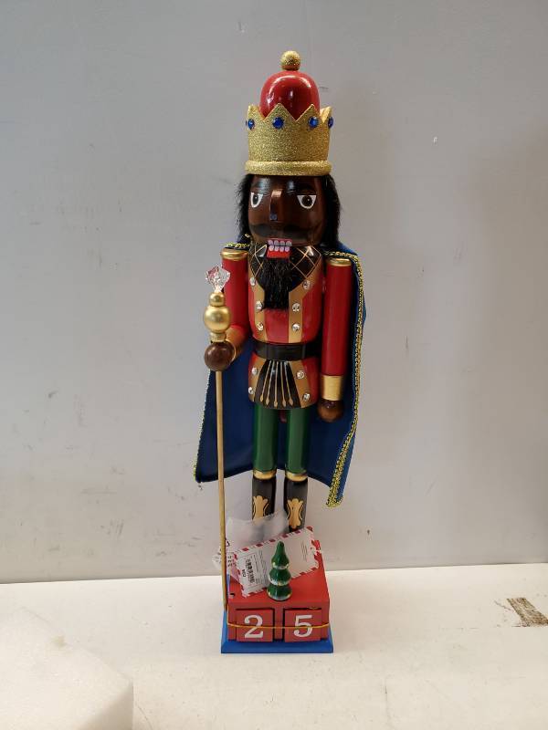 lot 26838 image: 14in African American Wooden Christmas Nutcracker. Missing a Foot and Something at the Back Corner of the Base. - Retail $60