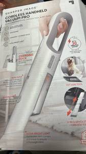 lot 16032 image: Sharper Image Cordless Handheld Vacuum Pro with Charging Dock