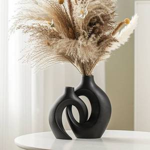 lot 48707 image: Lvases Snuggle Hollow Modern Ceramic Vase Set of 2, Mid Century Nordic Aesthetic Decorative Vase Decorative Vases for Home Table Decor (Matte Black W 6.3 X H 8.4) - Retail $30
