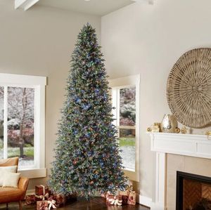 lot 1002 image: 12 ft Artificial Christmas Tree with LED Lights listed as open box because did not put all together, but powered on lower section and it worked I believe it is new - Retail $1500