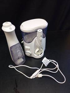 lot 1054 image: Electric Water Flosser with Reservoir and Tips - Retail $25