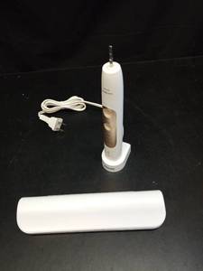 lot 1099 image: Philips Sonicare Electric Toothbrush with Charging Base and Replacement Heads - Retail $75