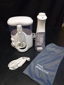 lot 1253 image: Waterpik Water Flosser Complete System with Accessories - Retail $45