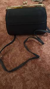 lot 60707 image: Black Leather Frame Handbag with Gold Clasp - Retail $25