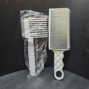 lot 2054 image: 2PCS Barber Fade Combs. set of two professional barber fade combs designed for blending, tapering, and creating gradient hairstyles.