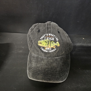 lot 2086 image: Vintage-style dad hat with a relaxed, unstructured fit. It s made from a dark charcoal or washed black denim-like cotton fabric that has been treated to give it a faded, broken-in look, especially around the seams and the brim. Thats what I do I fish